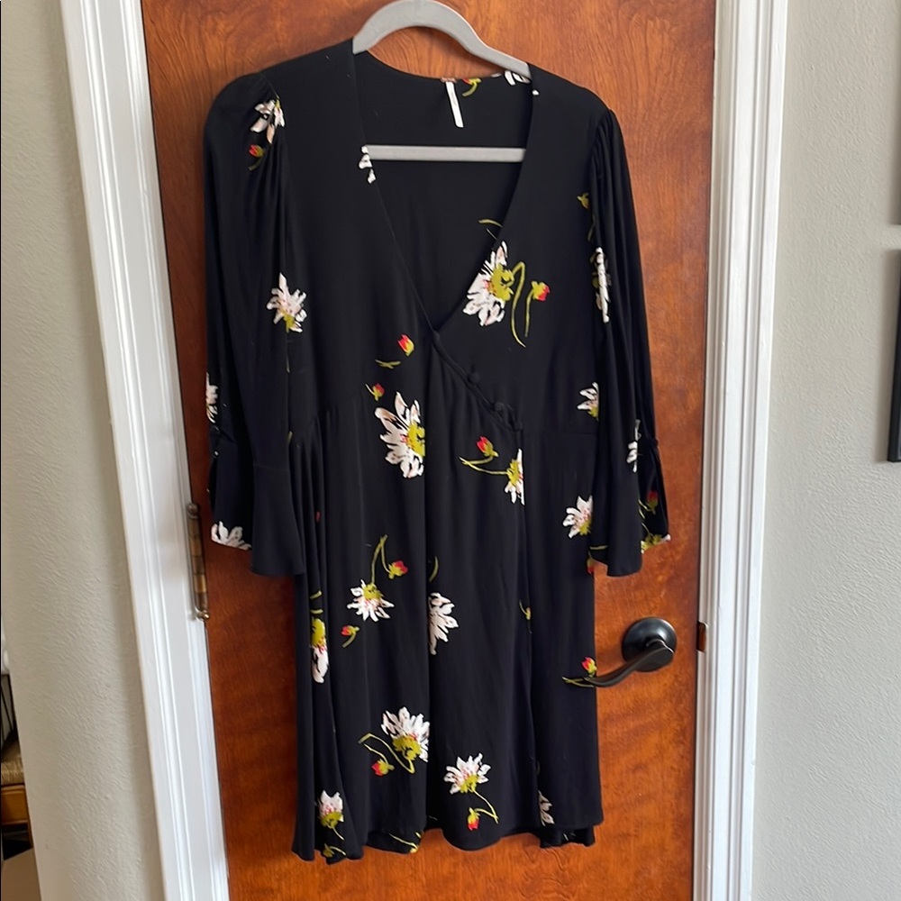 Free People Floral Black Dress. Size small. Wraps in front with vented  sleeves